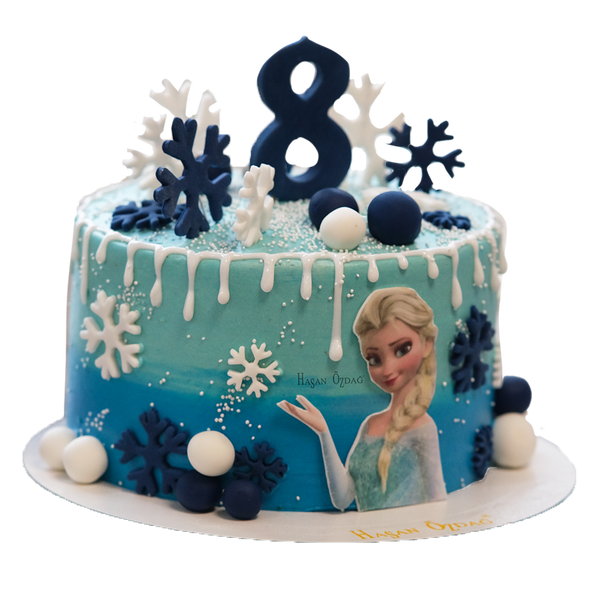 Blauer Elsa-Drip-Cake mit Kugeln und Schneeflocken