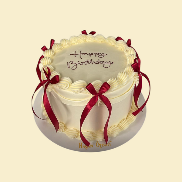 Runde Buttercreme Torte mit Roter Schrift und Schleifen