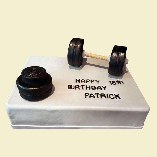 Torte mit Hanteln und Hantelbank