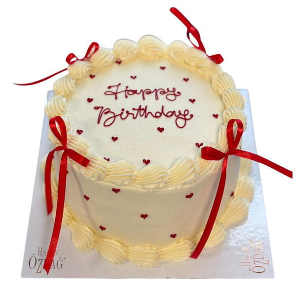 runde Buttercreme Torten mit roten Schleifen und Herzen