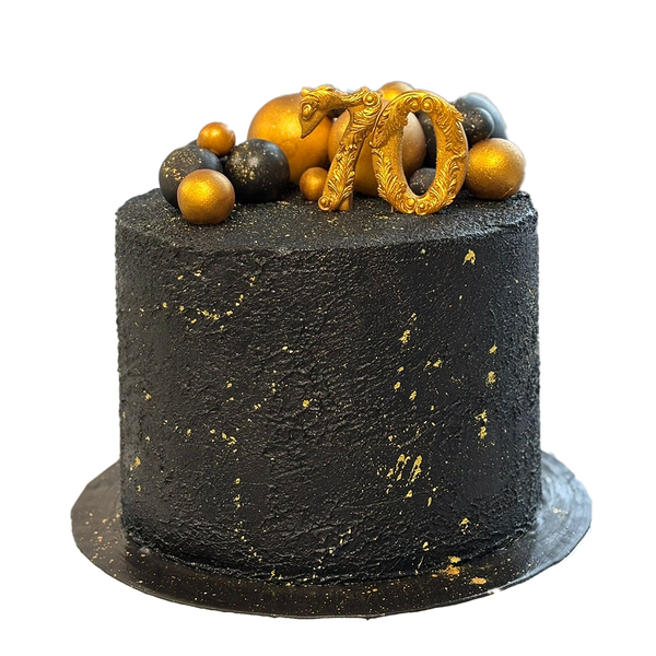 Schwarze Torte mit Struktur, Goldspritzern und Kugeln