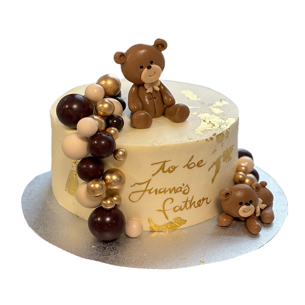 Weiße Bärchen-Torte mit Kugeln, Blattgold und Teddys