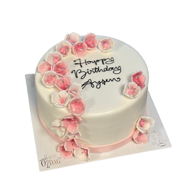 Weiße Torte mit rosa Kirschblüten