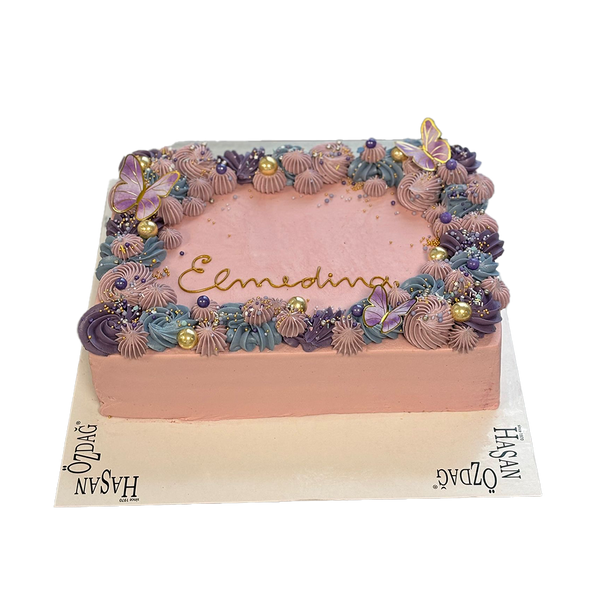 Eckige Torte mit Spritzdeko, goldenen Perlen und Schmetterlingen