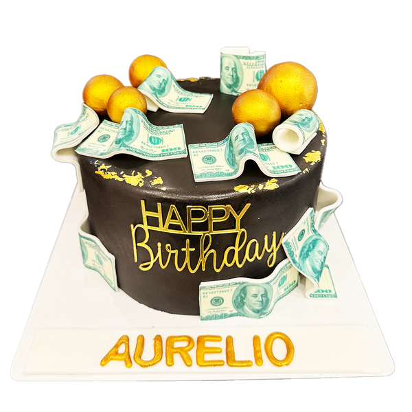 Schwarze, einstöckige Torte mit Blattgold, goldenen Kugeln und Geldscheinen