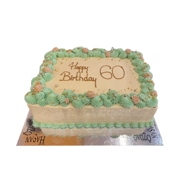 Schlichte weiße Torte mit mint-grüner Spritzdeko