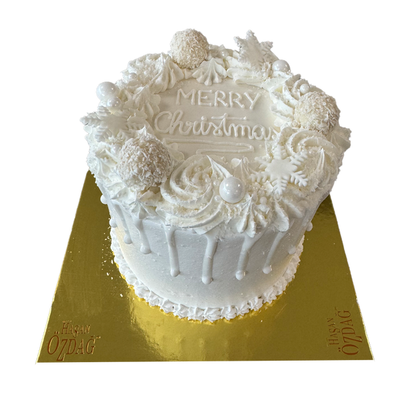 Komplett weiße Weihnachtstorte mit Raffaelos  und Spritzdeko