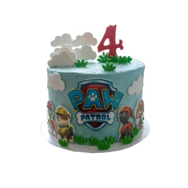 Blaue Paw Pawtrol Torte mit Wolken, den Hunde-Charakteren und Gras.