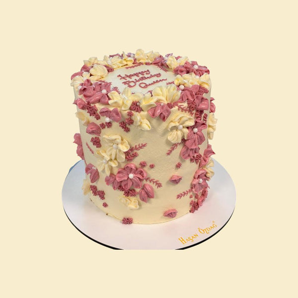 Blumentorte „Happy Birthday“ in Rosa und Creme