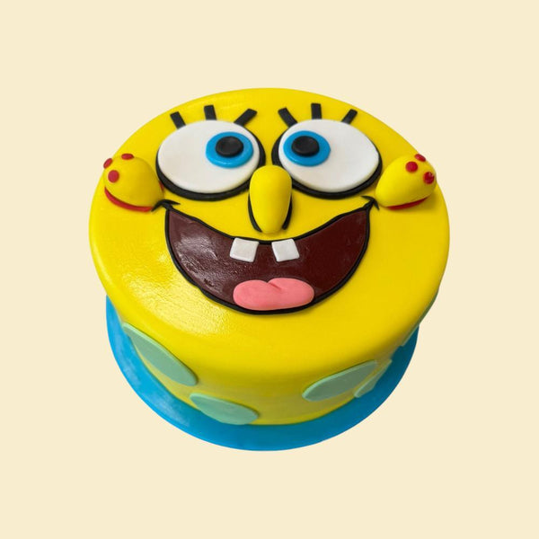 Gelbe Motivtorte mit lustigem Gesicht