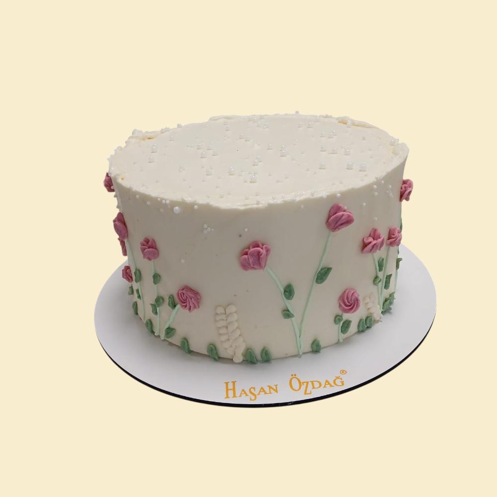 Blumentorte „Happy Birthday“ in Rosa und Creme