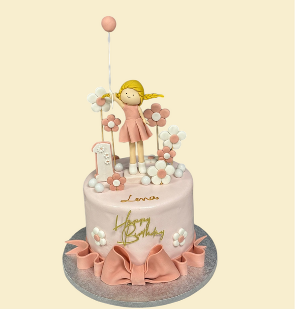 Mädchenhafte Geburtstagstorte mit Figur – Rosa Torte zum 1. Geburtstag