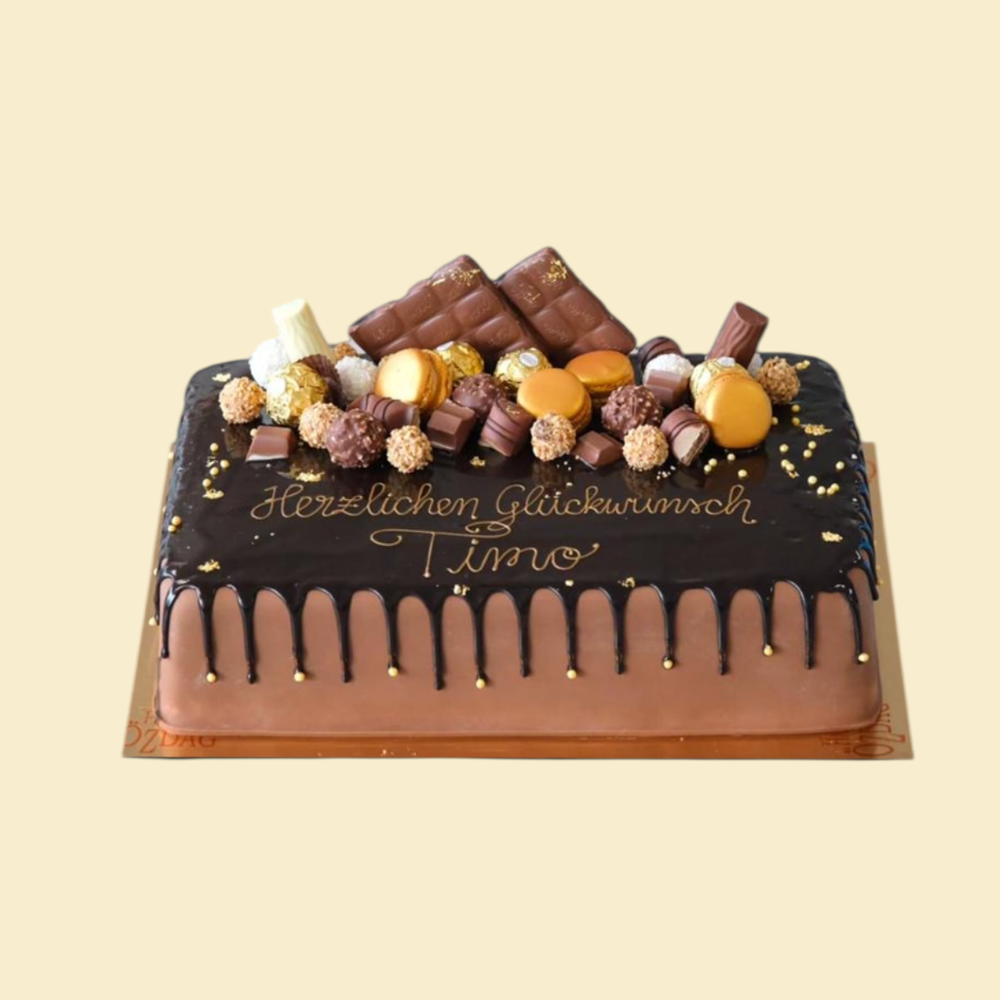 Eckige Schokotorte mit Drip, goldenen Perlen, Schokolade, Rocher, Duplo, Macarons und Kinder-Schokolade