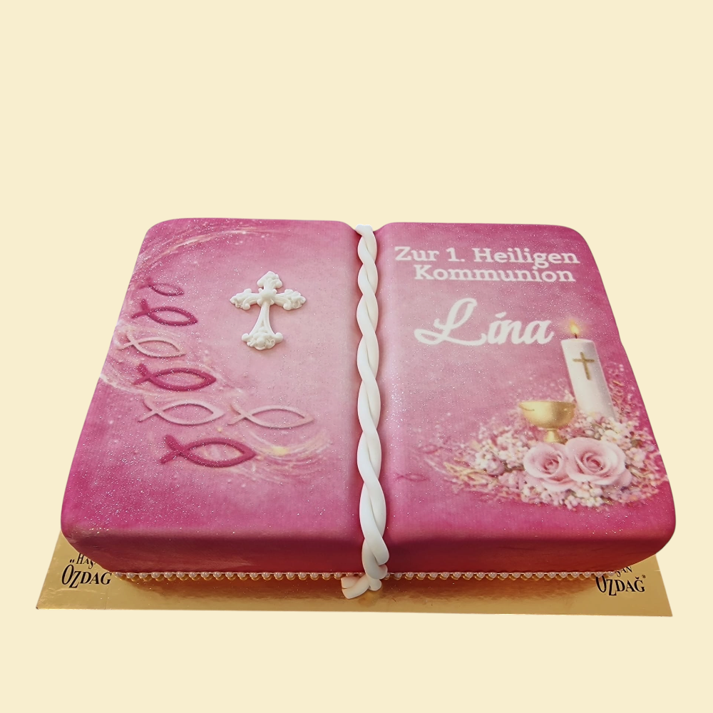 Kommunionstorte Buchoptik – Rosa mit Kreuz & Fischsymbolen auf Fondantdruck