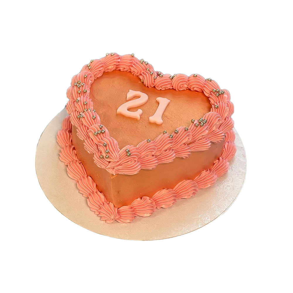 Herzförmige rosa Coquette-Torte mit Perlen