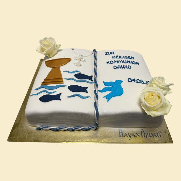 Kommunionstorte in Buchform mit Fischen , Tauben . Kelch und Rosen