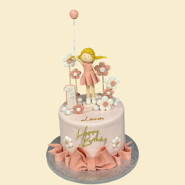 Mädchenhafte Geburtstagstorte mit Figur – Rosa Torte zum 1. Geburtstag