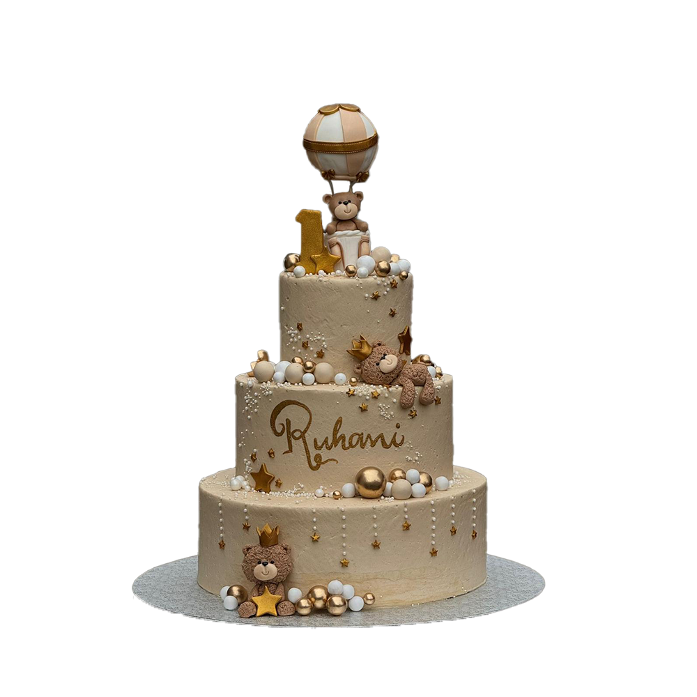 3 stöckige, beige Torte mit Kugeln, Sternchen, Perlen und Bärchen . Ein Bär sitzt in einem Ballon, die anderen beiden tragen eine Krone