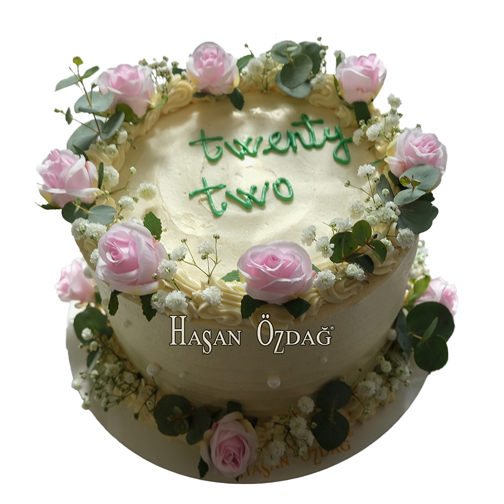 Weiße Coquette-Torte mit rosa Rosen und Schleierkraut