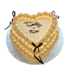 Herzförmige Coquette-Torte in Kaffee-Tönen mit schwarzen Schleifen