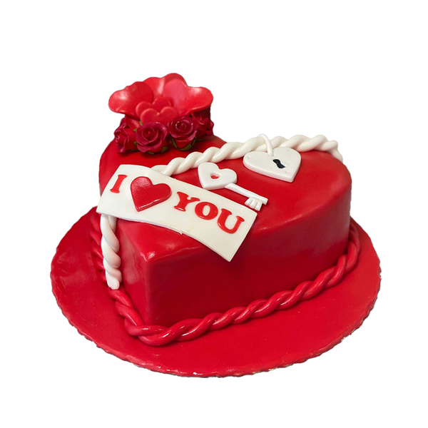 Herztorte aus roten Fondant und weißen Schloss mit Schlüssel. Diese Valentinstags-Torte enthält ein "I love you"-Banner, sowie Rosen und Herzen aus Fondant.