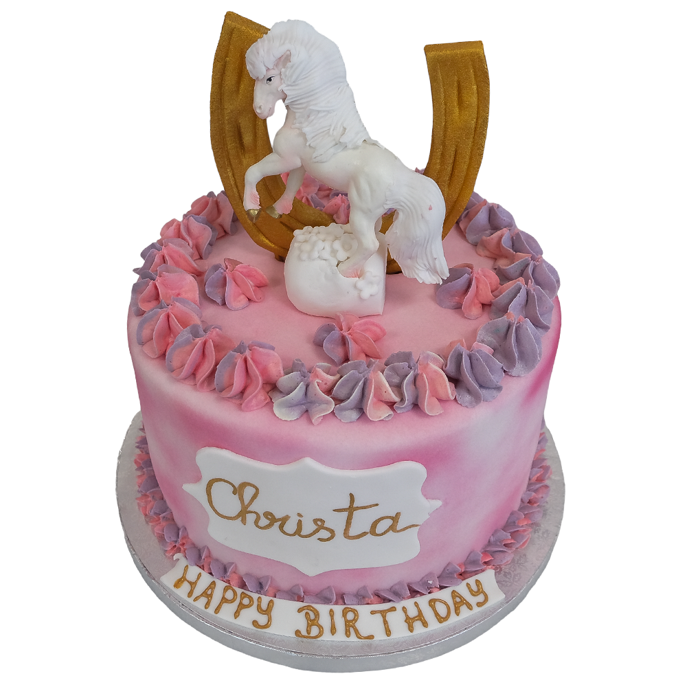 Rosa torte mit rosa-lila Spritzdeko und Ponyfigur mit  goldenen Hufeisen