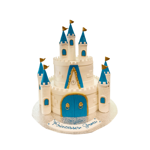 weiße Formtorte in  Schloss-Form mit Blauen Akzenten