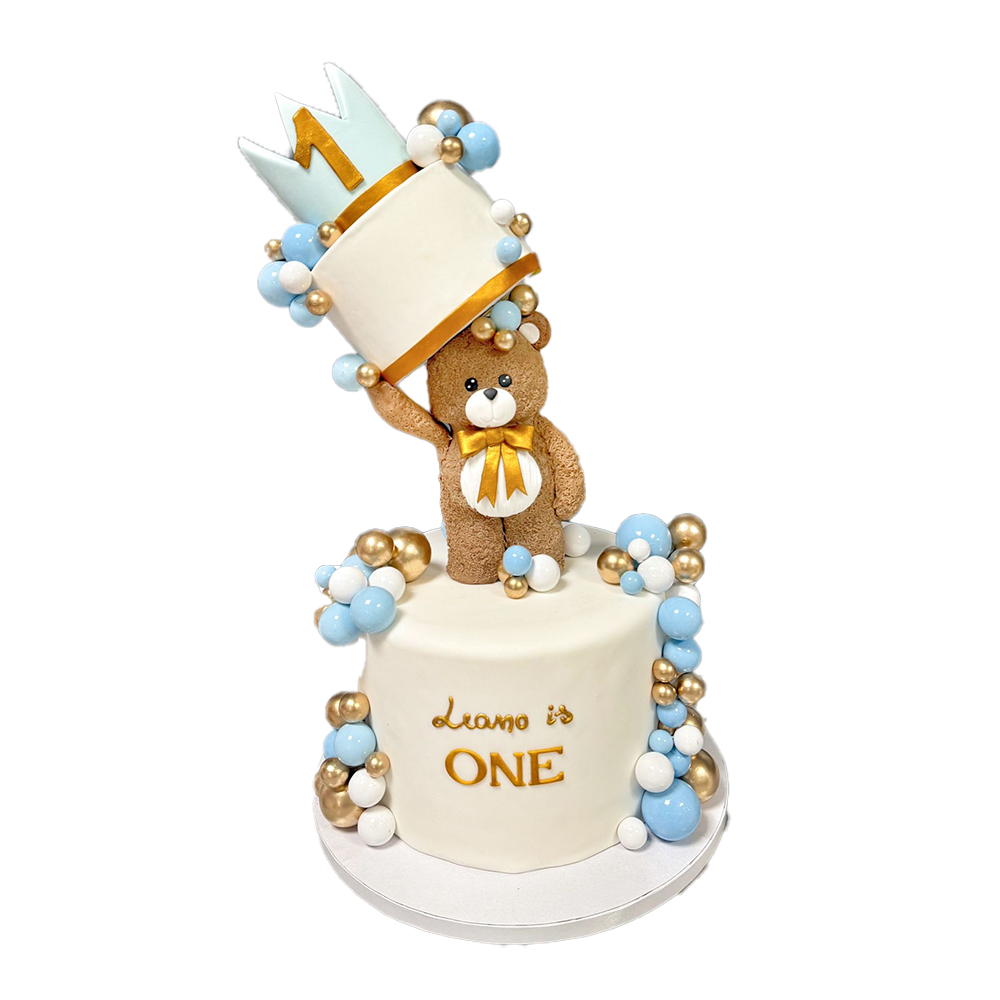 Weiße Teddytorte mit Teddy, Krone blauen, goldenen und weißen Kugeln