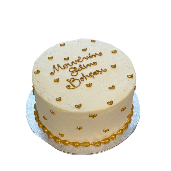Weiße Torte mit goldenen Herzen
